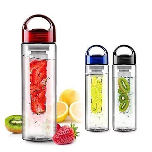Three infuser water bottles with fruits inside on a white background